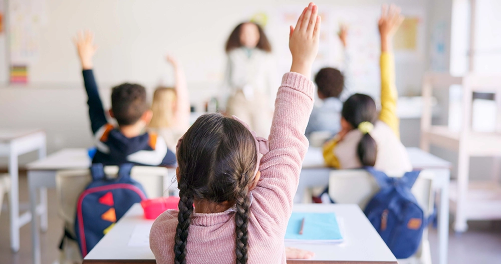 Students participating in a classroom lesson