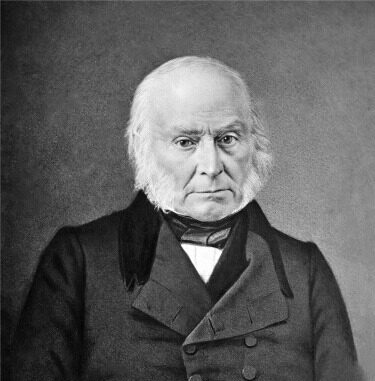 Black and white portrait of a middle-aged man with white hair, wearing a formal coat and a stern expression.
