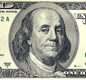 Image of a one hundred dollar bill featuring a portrait of Benjamin Franklin.