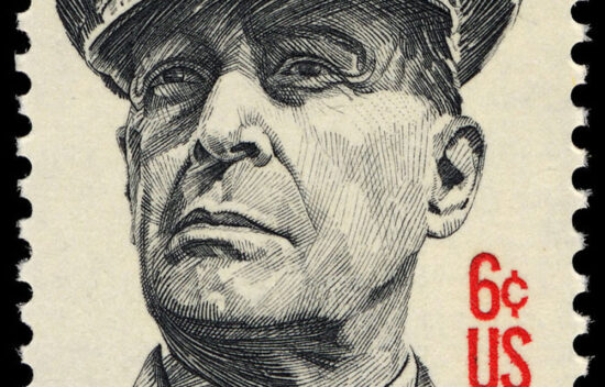 Portrait of a stern man in a military uniform on a vintage 6-cent U.S. postage stamp.