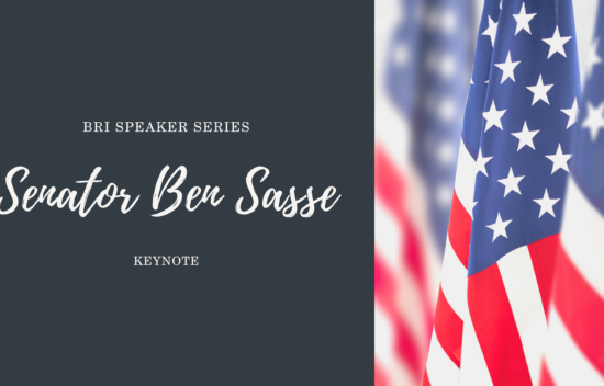 A graphic featuring the text "Senator Ben Sasse Keynote" alongside American flags in a blurred background.