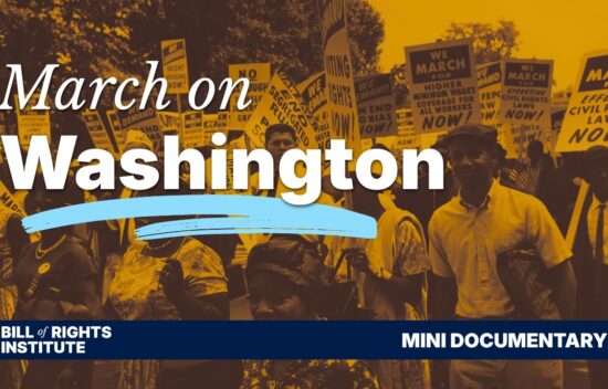 Black and white photo of protesters holding signs during the March on Washington event.