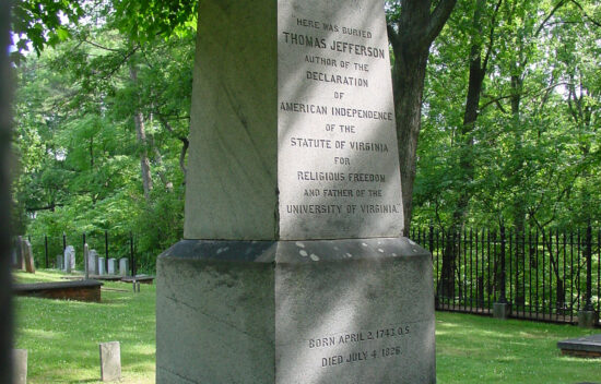Gravestone of Thomas Jefferson, author of the Declaration of Independence, located in a green cemetery.