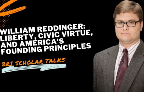 A man in a suit stands next to text promoting a talk by William Reddinger on liberty and civic virtue.