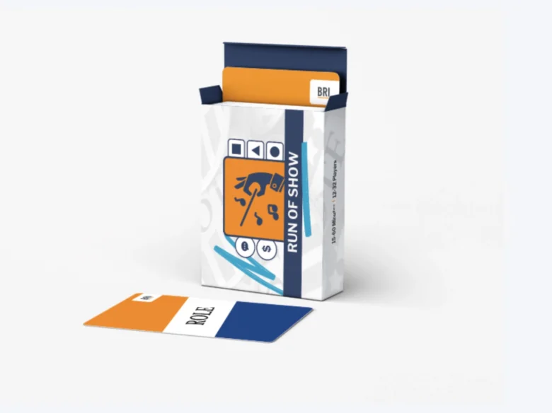 A card game box labeled 'Run of Show' with a visible card placed beside it.