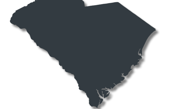 Outline of the state of South Carolina in dark color on a transparent background.