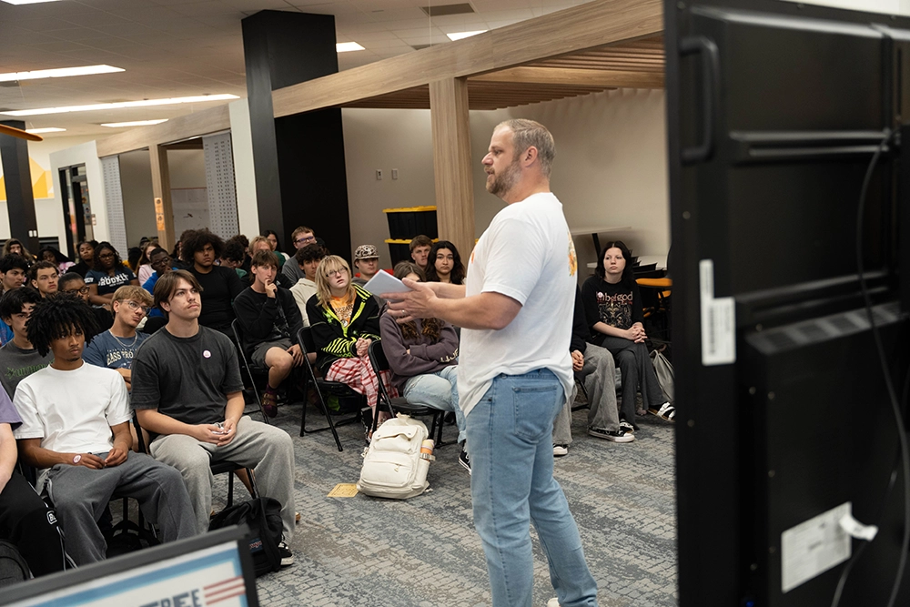 Teacher speaking with students during a civic learning program